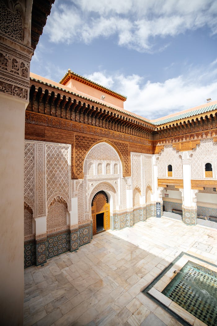 Explore the intricate Islamic architecture of Ben Youssef Madrasa in Marrakesh, Morocco.