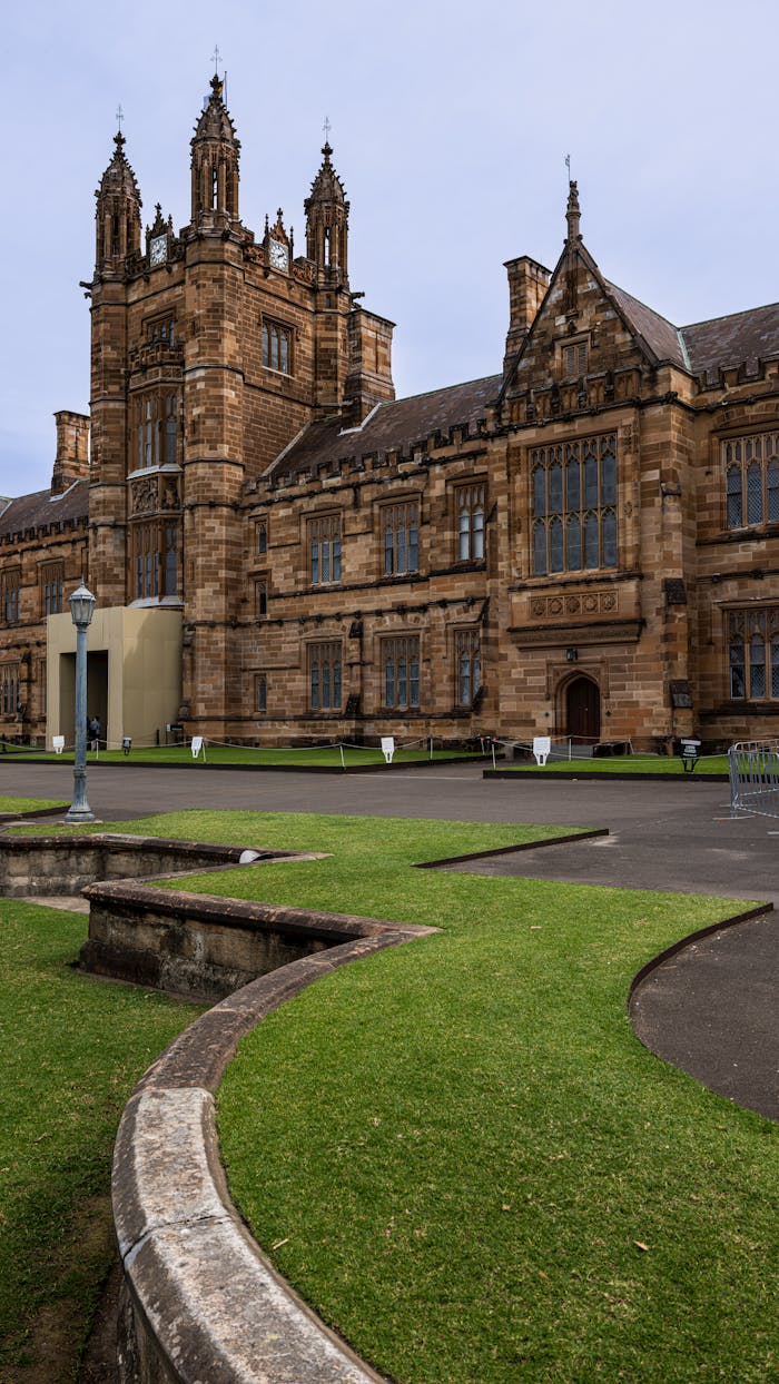 Stunning view of historic sandstone buildings at the University of Sydney, highlighting Gothic Revival architecture.